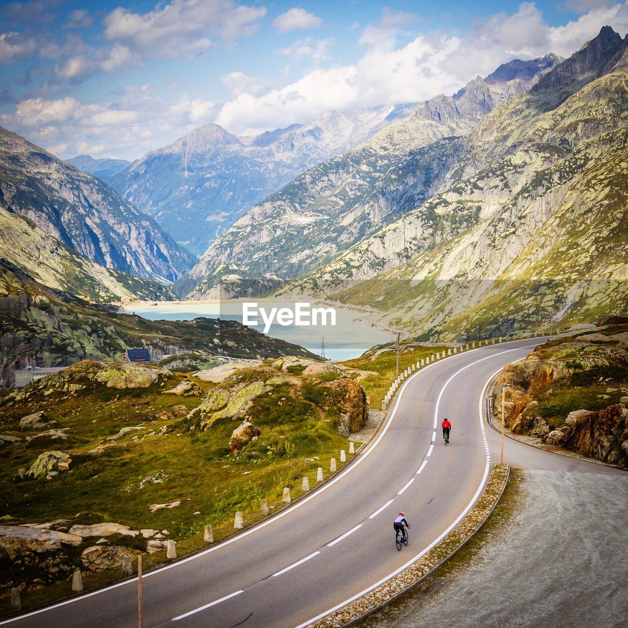 High angle view of people riding bicycles on mountain road