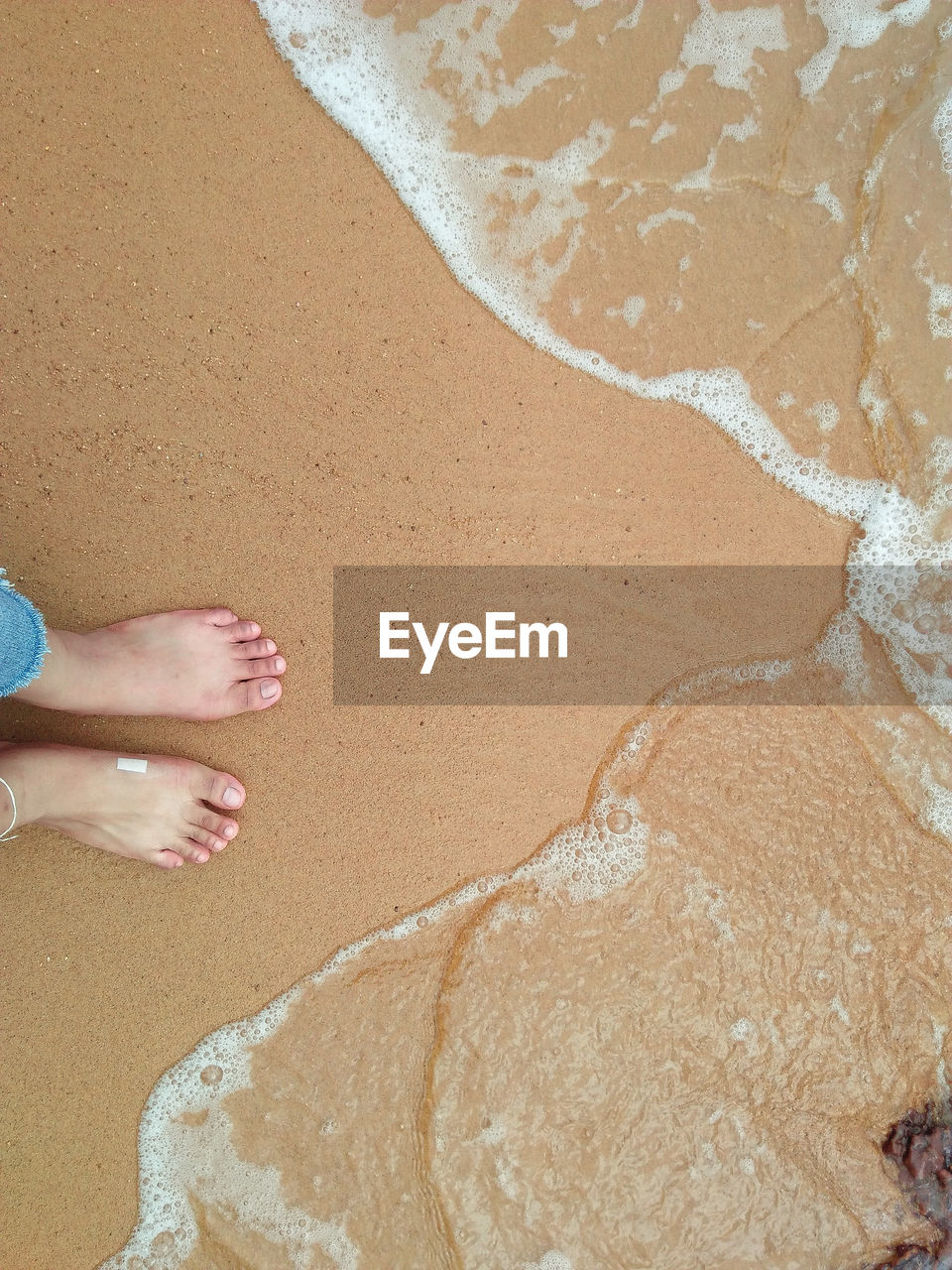 Low section of woman on beach