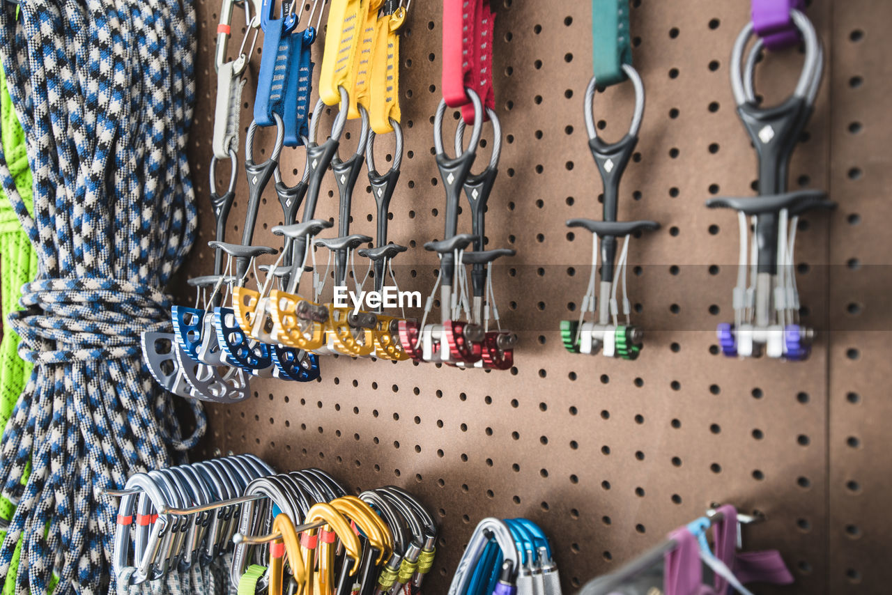 Close-up of climbing equipment hanging at store