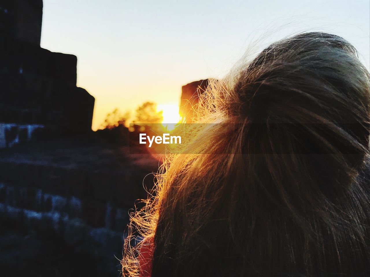 PORTRAIT OF WOMAN AGAINST SKY DURING SUNSET