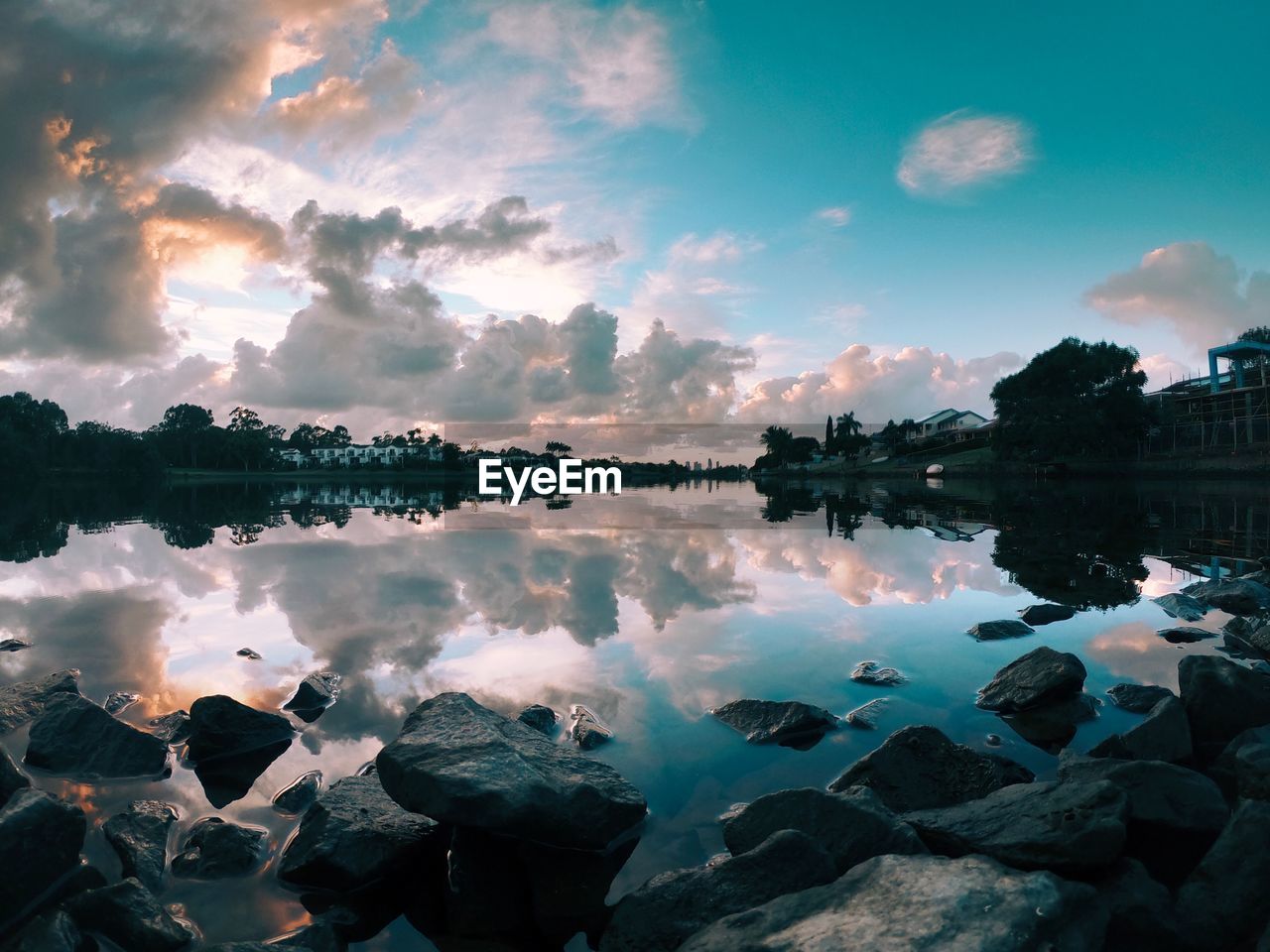 Scenic view of lake against sky during sunset