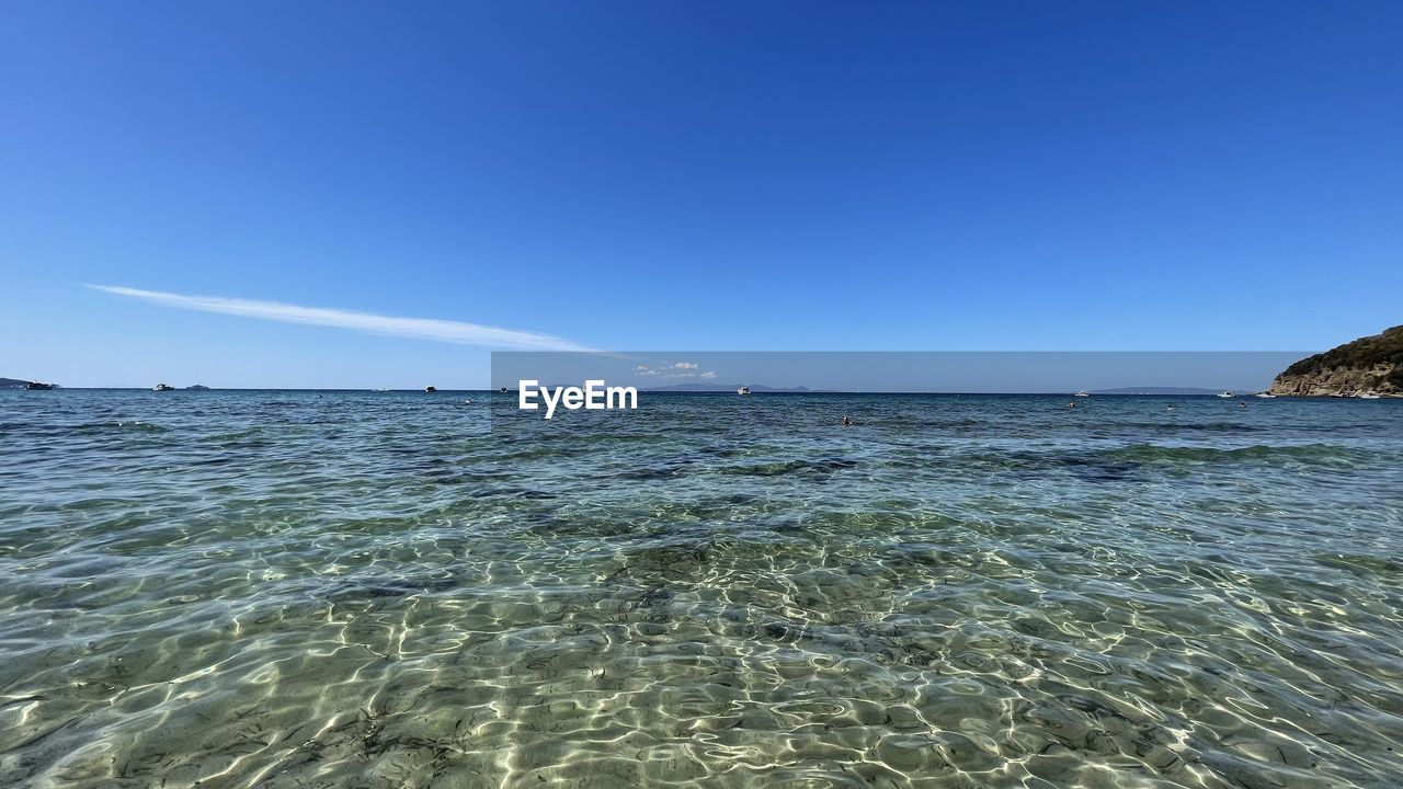 SCENIC VIEW OF BEACH AGAINST CLEAR SKY