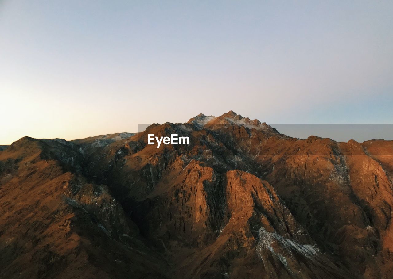 Scenic view of mountains against clear sky