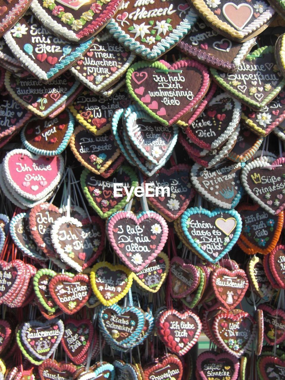 Full frame shot of heart shape decorations with text for sale in market