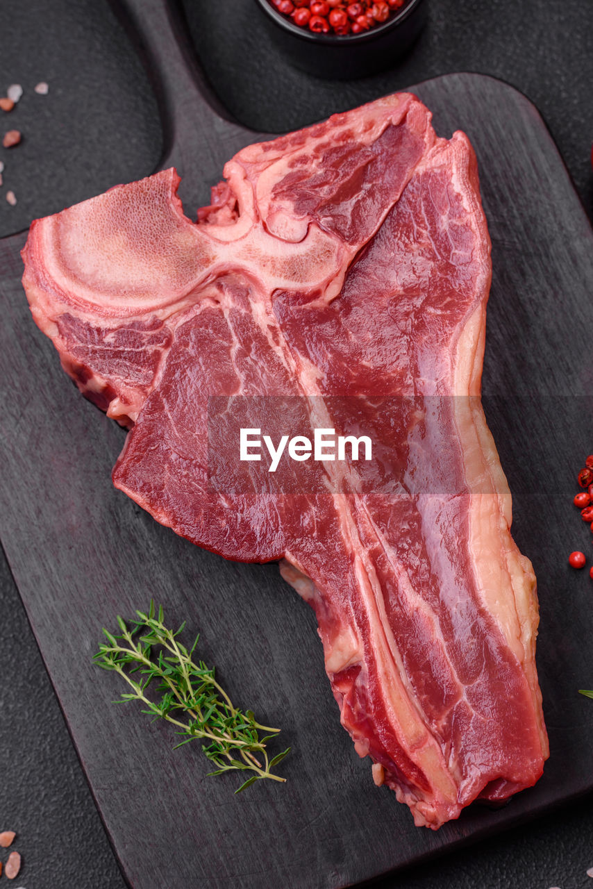 meat, food and drink, food, freshness, red meat, raw food, flesh, beef, steak, no people, indoors, lamb and mutton, dish, goat meat, veal, herb, ingredient, still life, high angle view, kobe beef, slice, spice, studio shot