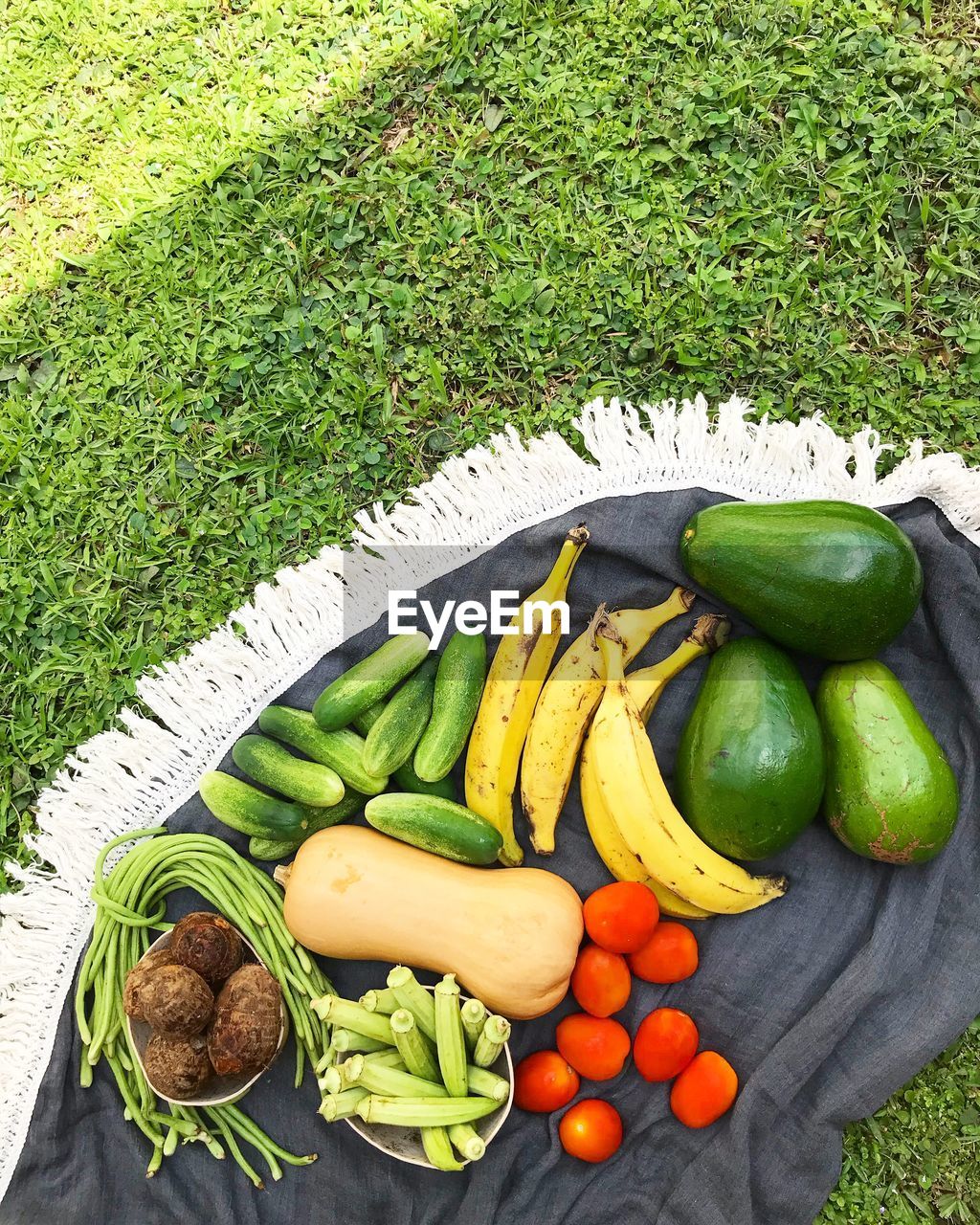HIGH ANGLE VIEW OF VEGETABLES IN BASKET ON GRASS