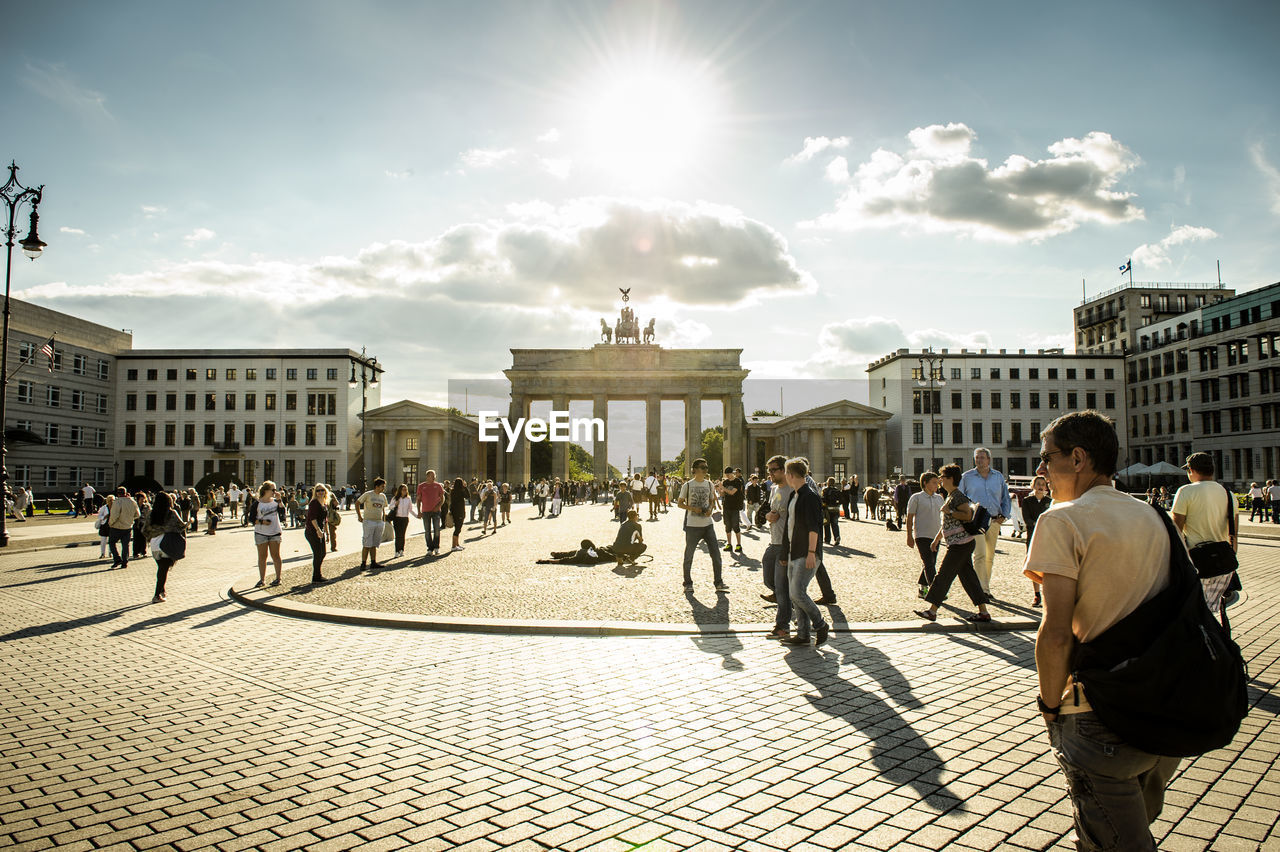 VIEW OF TOURISTS IN FRONT OF MODERN BUILDING