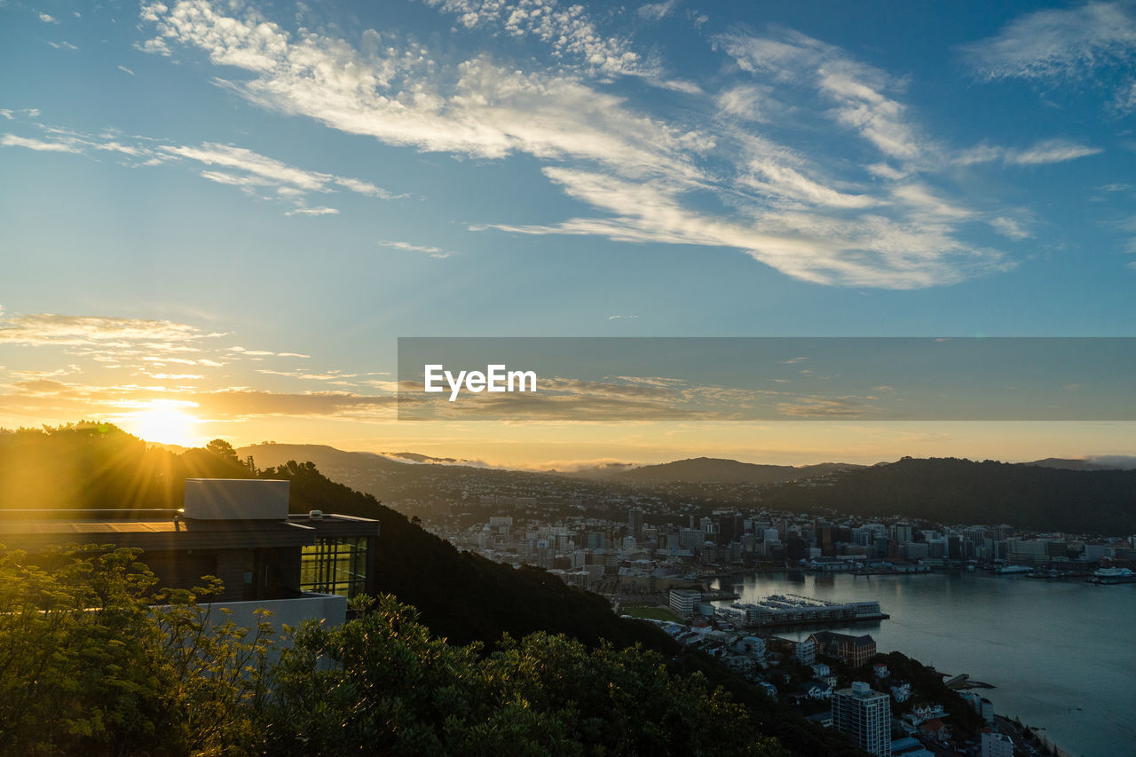 Cityscape against sky during sunset