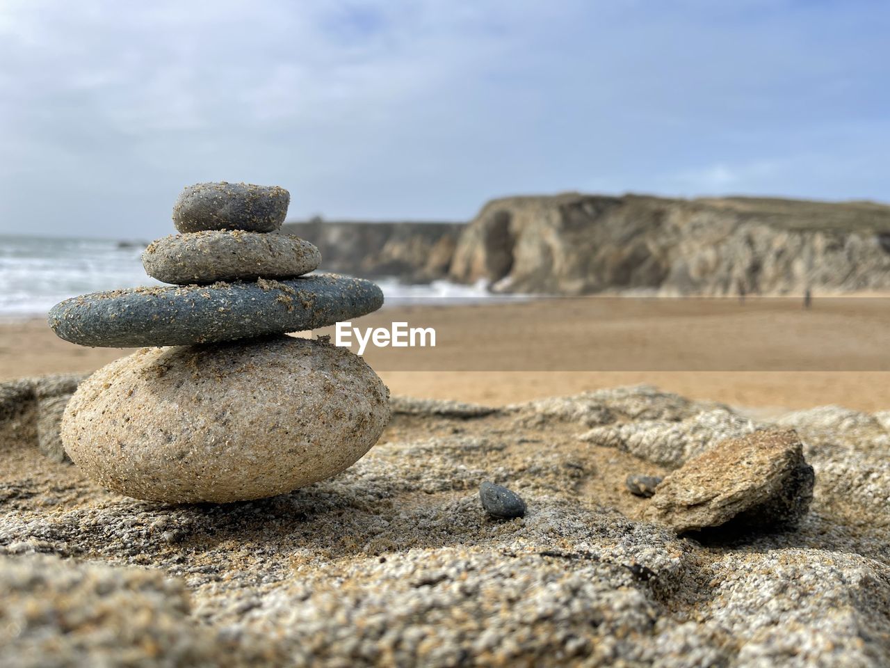 sand, rock, land, shore, zen-like, balance, pebble, beach, sea, stone, nature, sky, coast, tranquility, no people, water, cloud, day, tranquil scene, landscape, beauty in nature, scenics - nature, outdoors, geology, natural environment, environment, stability