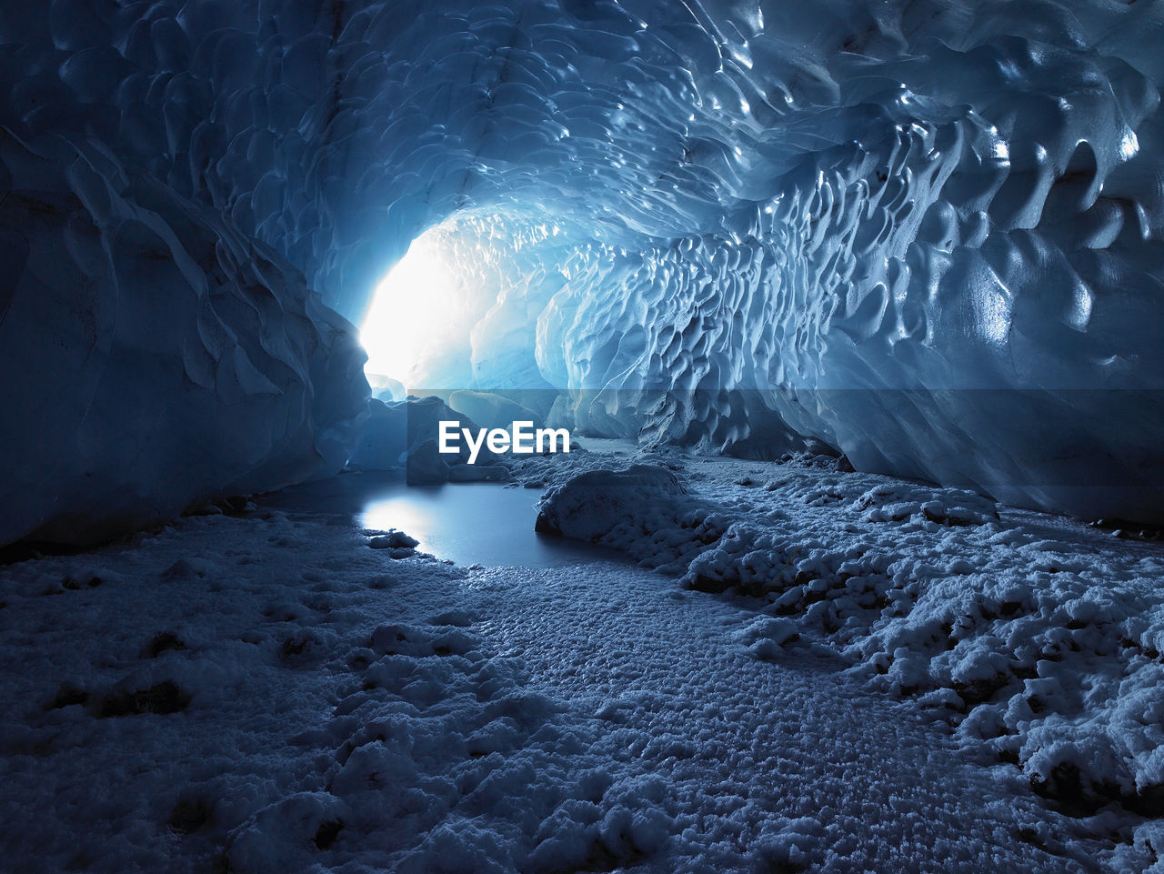 Light streaming into an ice cave in iceland