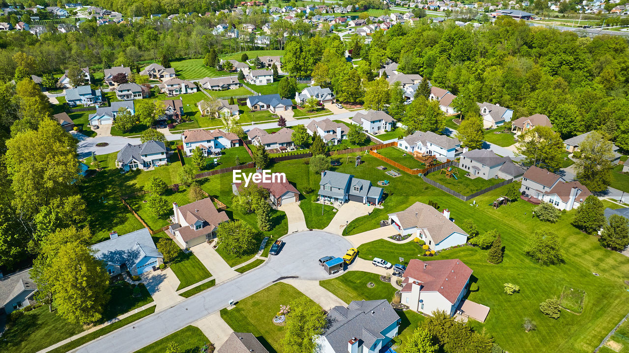 high angle view of trees and houses