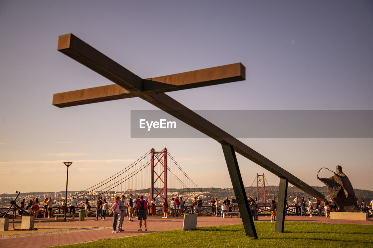 sky, architecture, group of people, nature, built structure, large group of people, crowd, travel destinations, outdoors, transportation, travel, men, water, grass