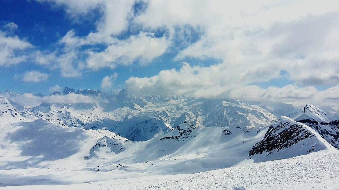 SNOW COVERED MOUNTAIN RANGE