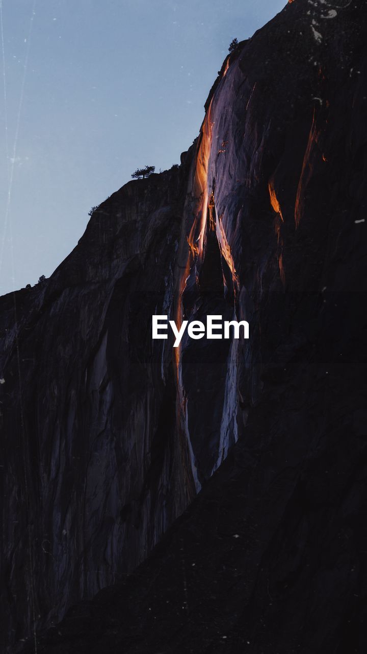mountain, nature, environment, sky, beauty in nature, geology, volcano, landscape, scenics - nature, rock, land, no people, lava, terrain, night, non-urban scene, outdoors, star, travel destinations, motion, power in nature, darkness, rock formation