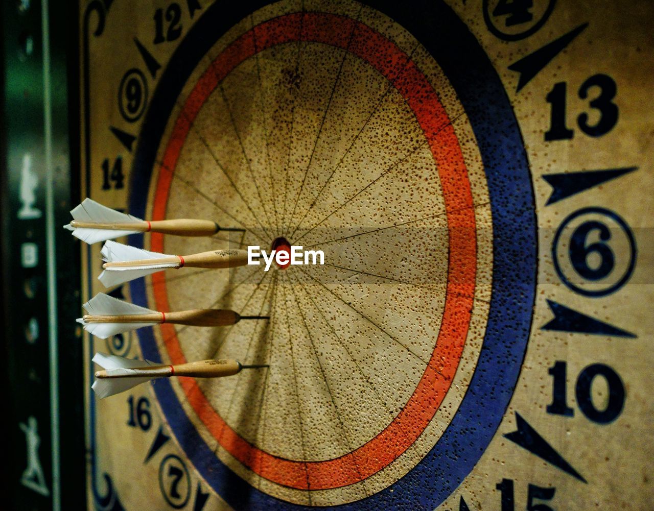 Close-up of dartboards with darts