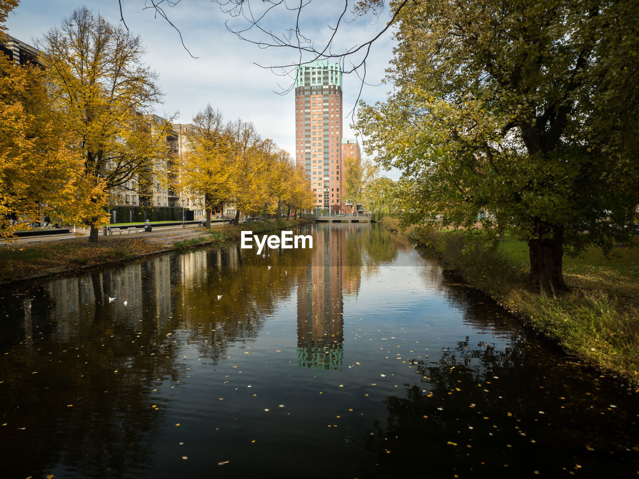 Reflection of trees in lake against sky during autumn