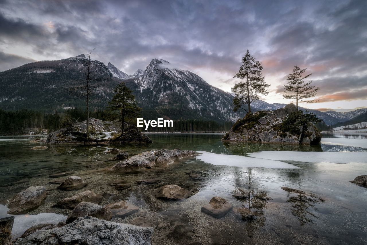 Scenic view of lake and mountains against sky