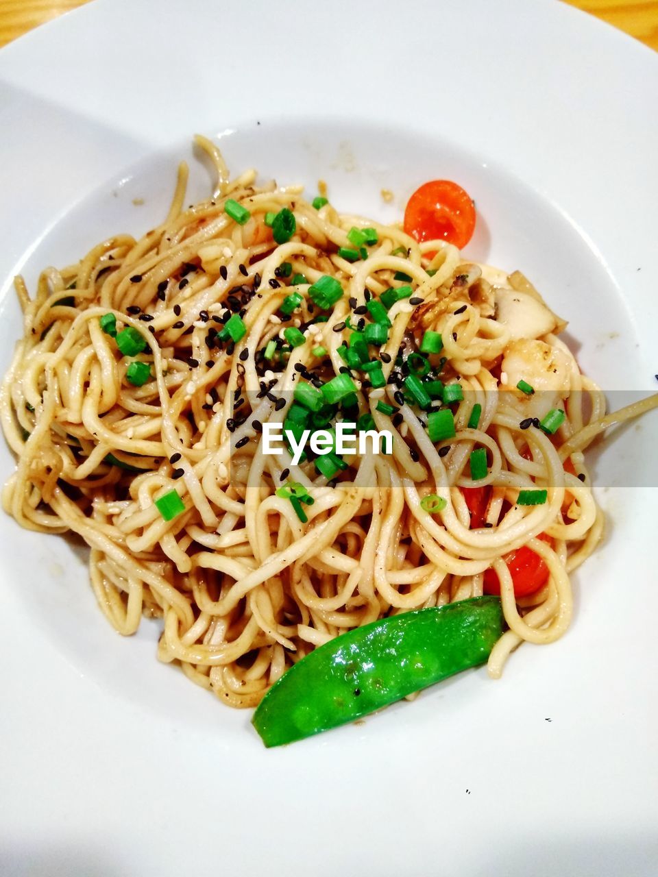 CLOSE-UP OF NOODLES SERVED IN PLATE WITH SAUCE