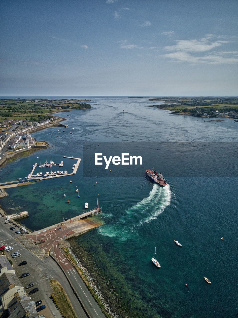 High angle view of boats on sea shore against sky