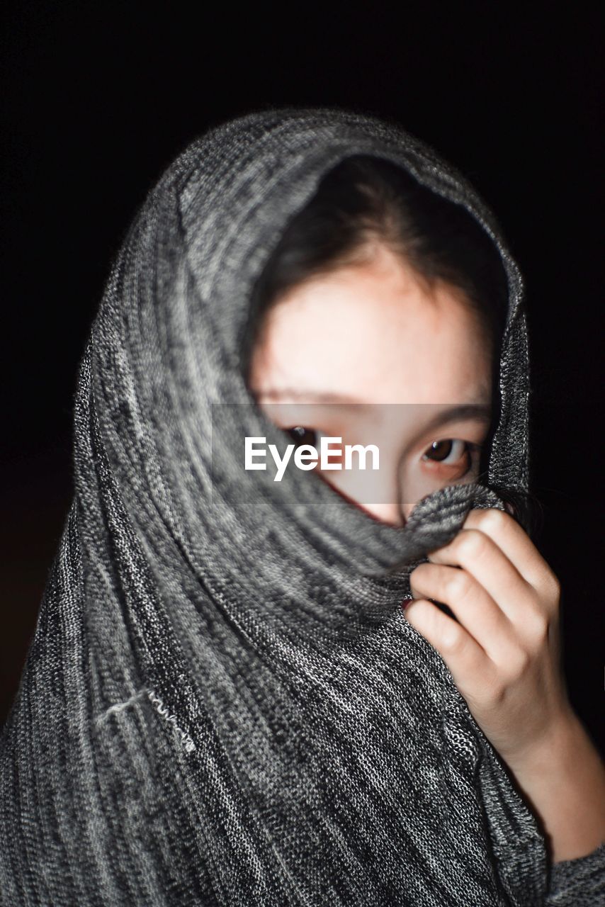 Close-up portrait of woman wearing headscarf