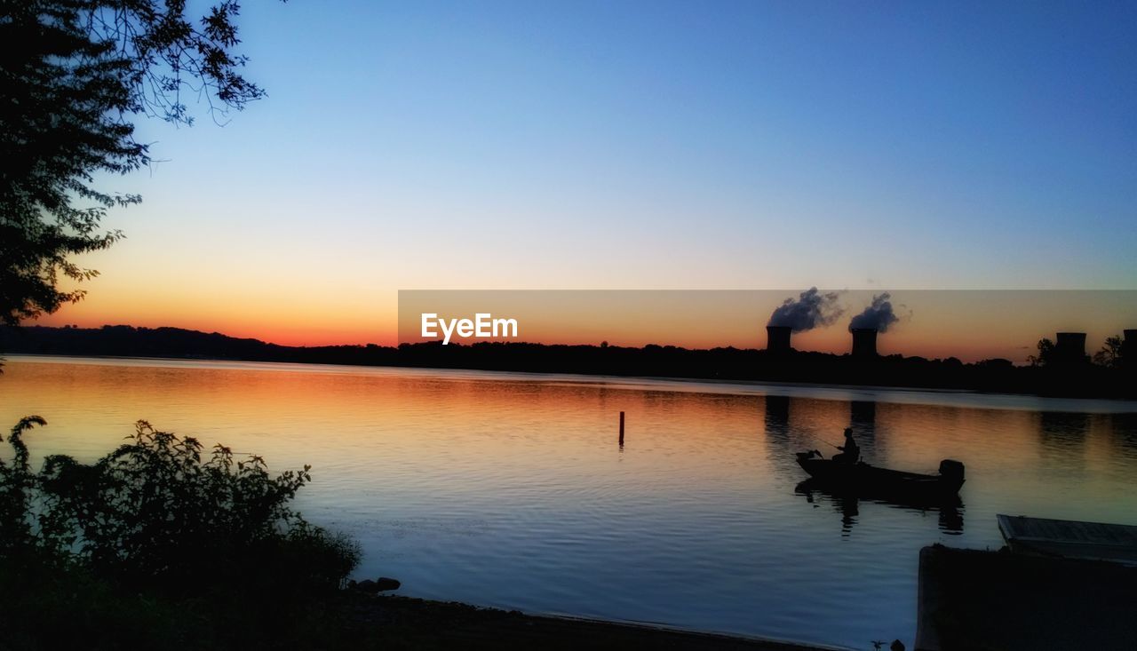 SCENIC VIEW OF SUNSET OVER SEA