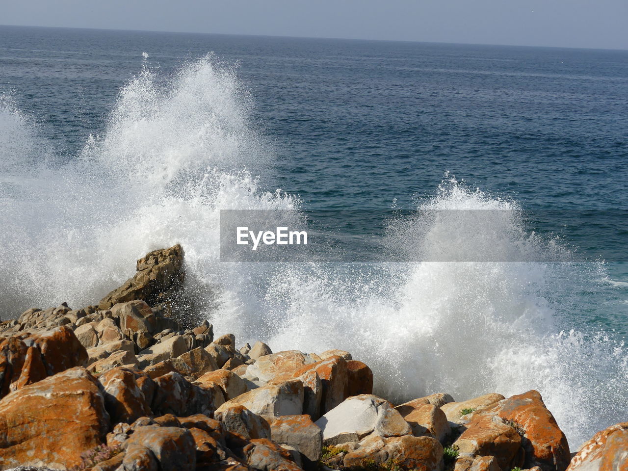 WAVES SPLASHING ON ROCKS