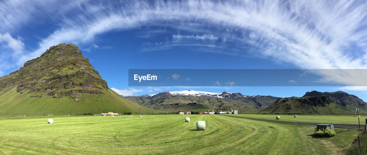 Panoramic view of farm against sky