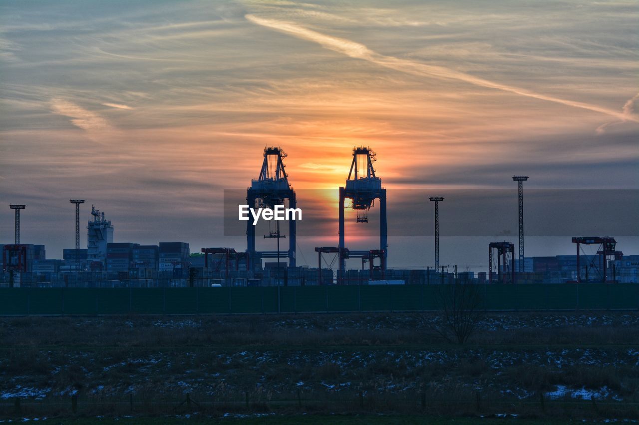 Traditional building against sky during sunset