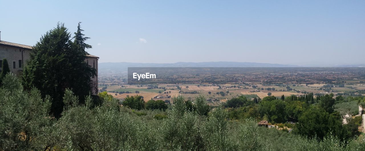 Countryside landscape against clear sky