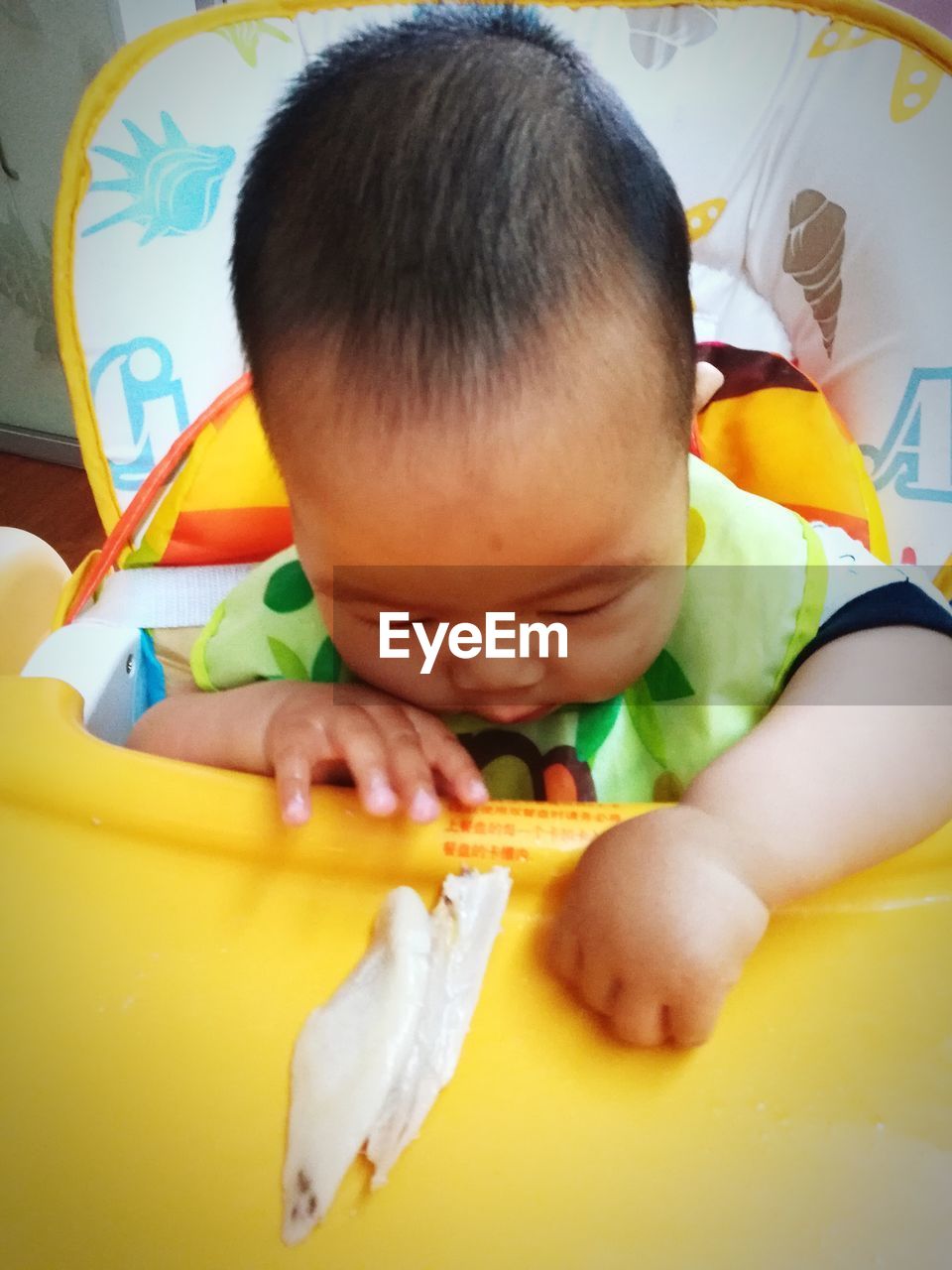 Close-up of baby playing with food