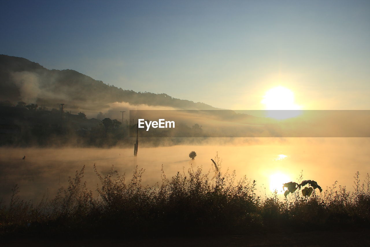Scenic view of silhouette landscape against sky during sunset