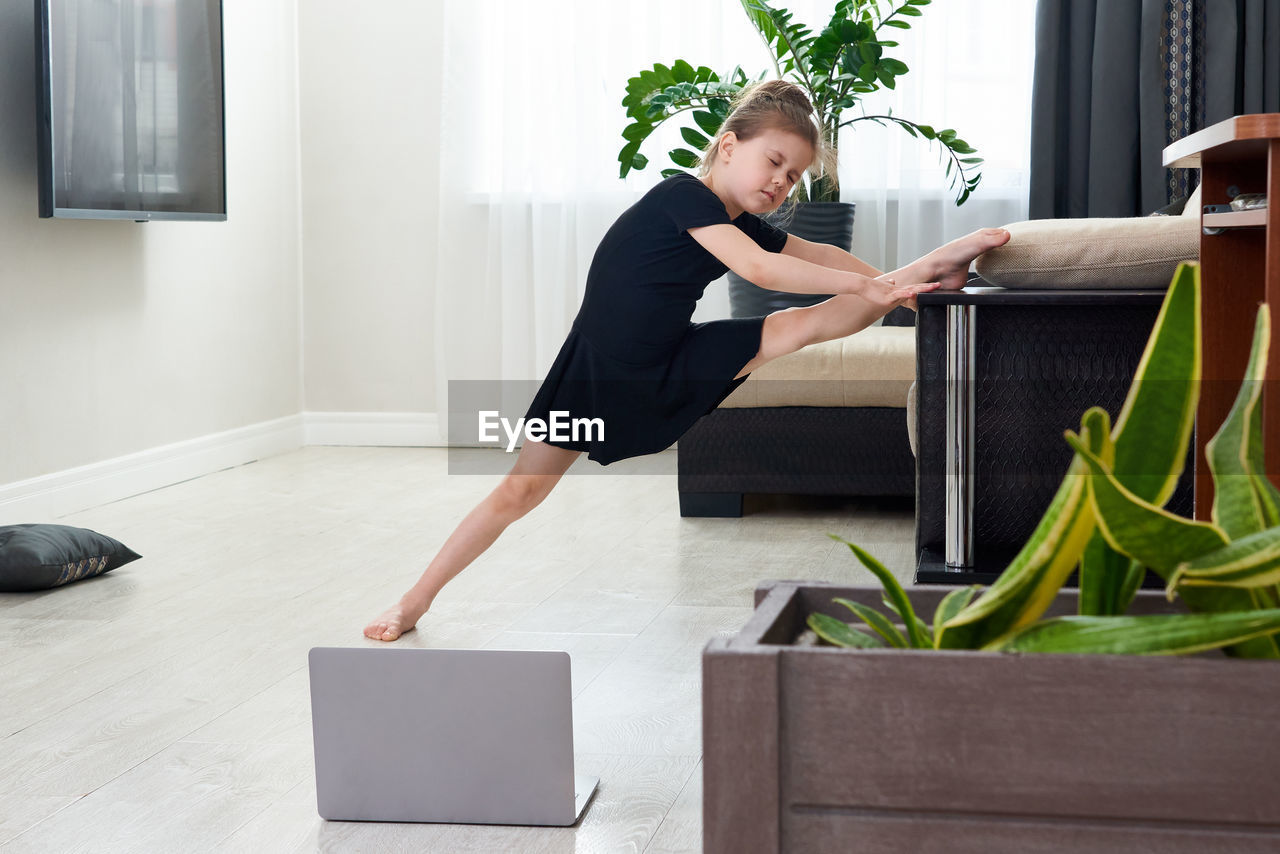 Girl stretching at home