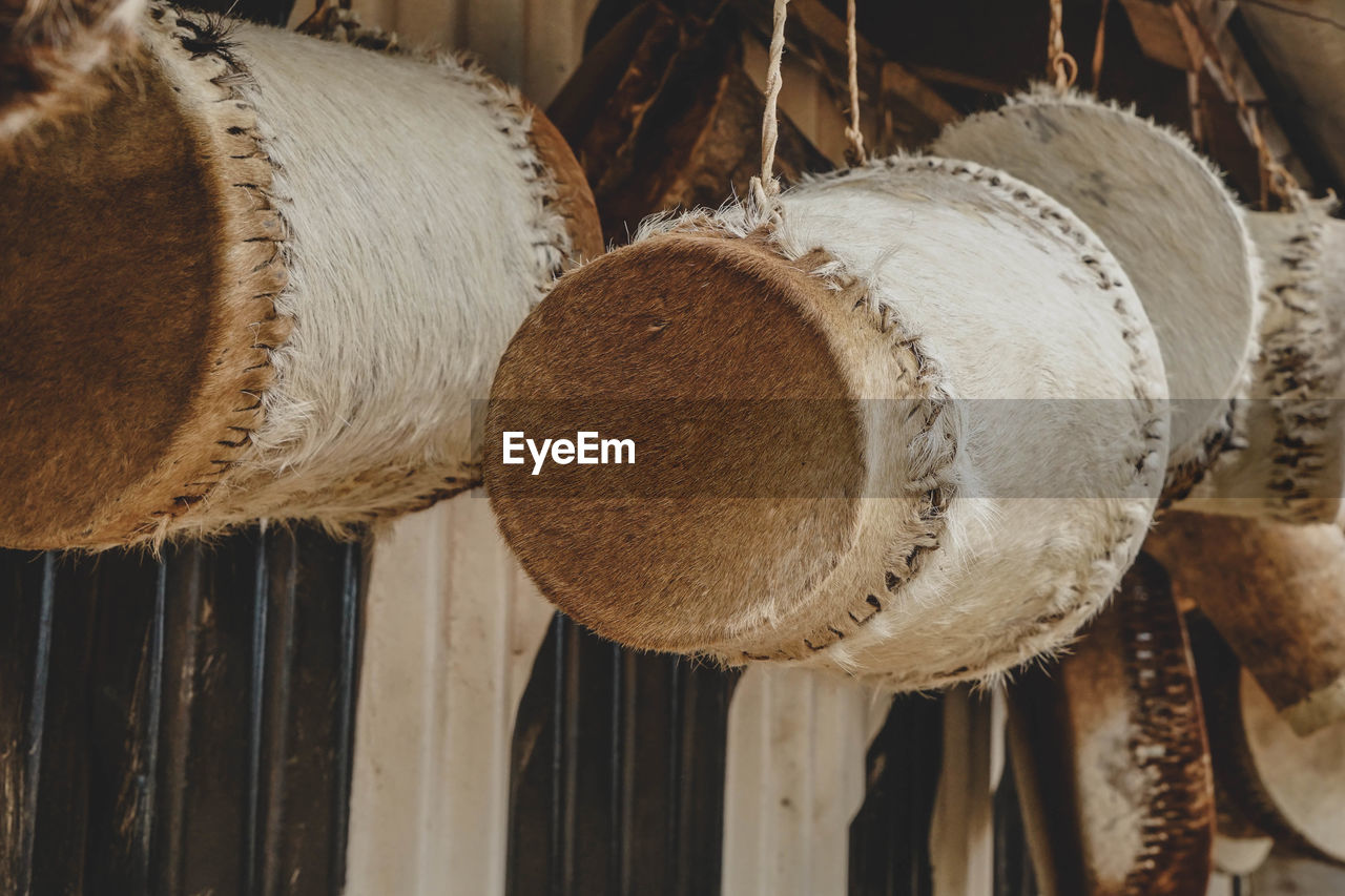 Close-up of container hanging on rope for sale