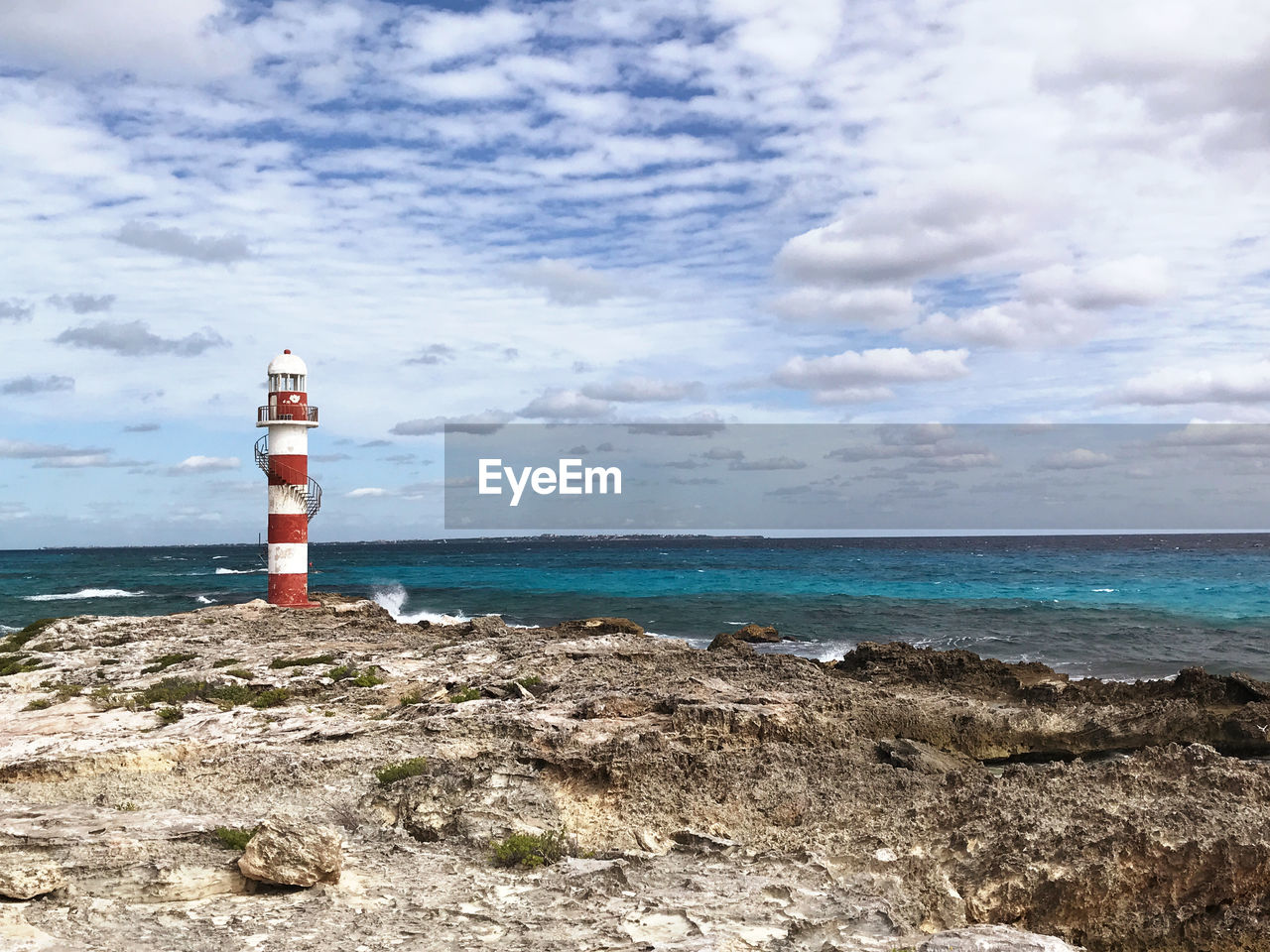 Lighthouse by sea against sky cancun