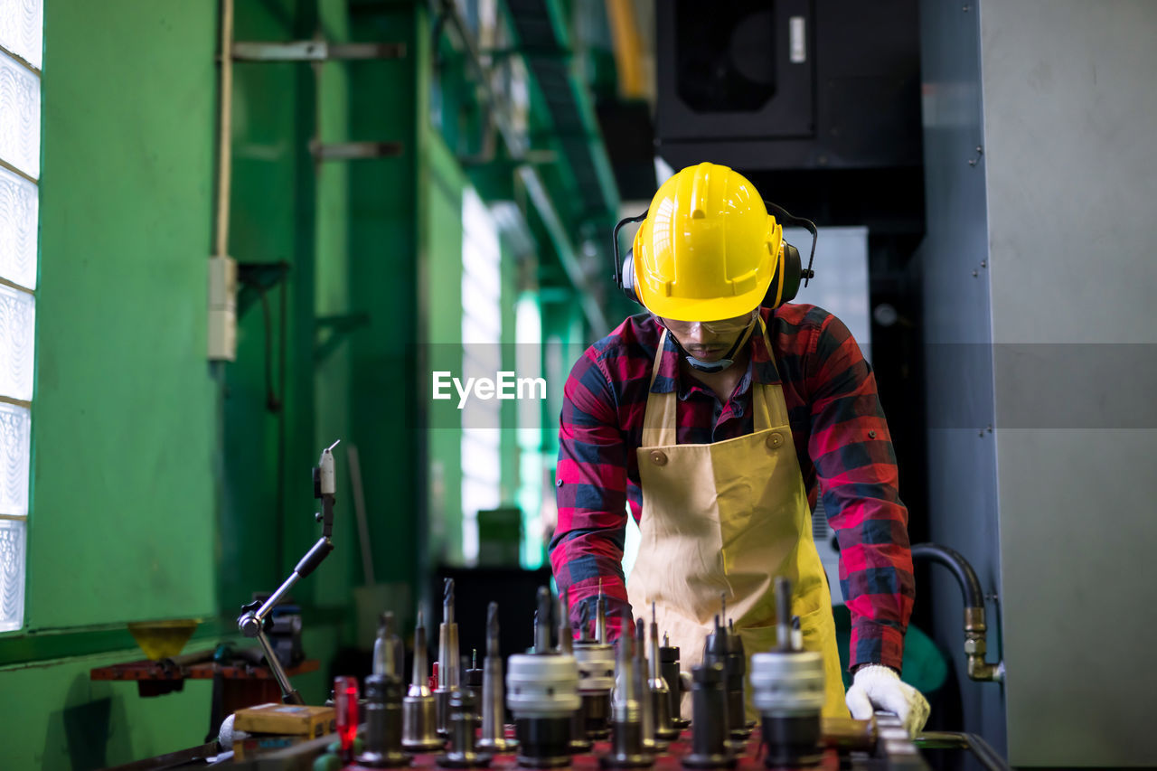 side view of man working at factory