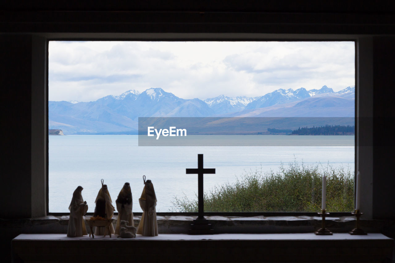 SCENIC VIEW OF SEA SEEN THROUGH WINDOW