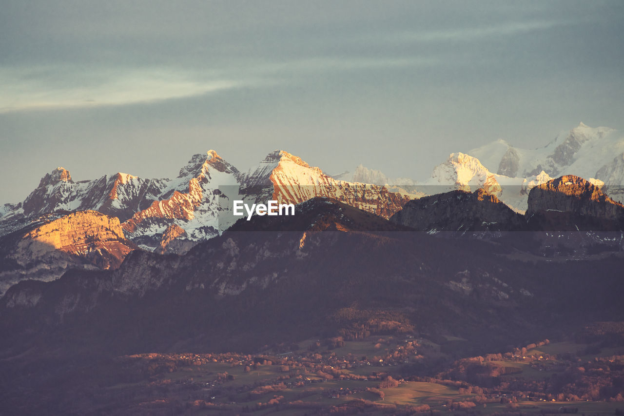 Scenic view of mountains against sky during sunset