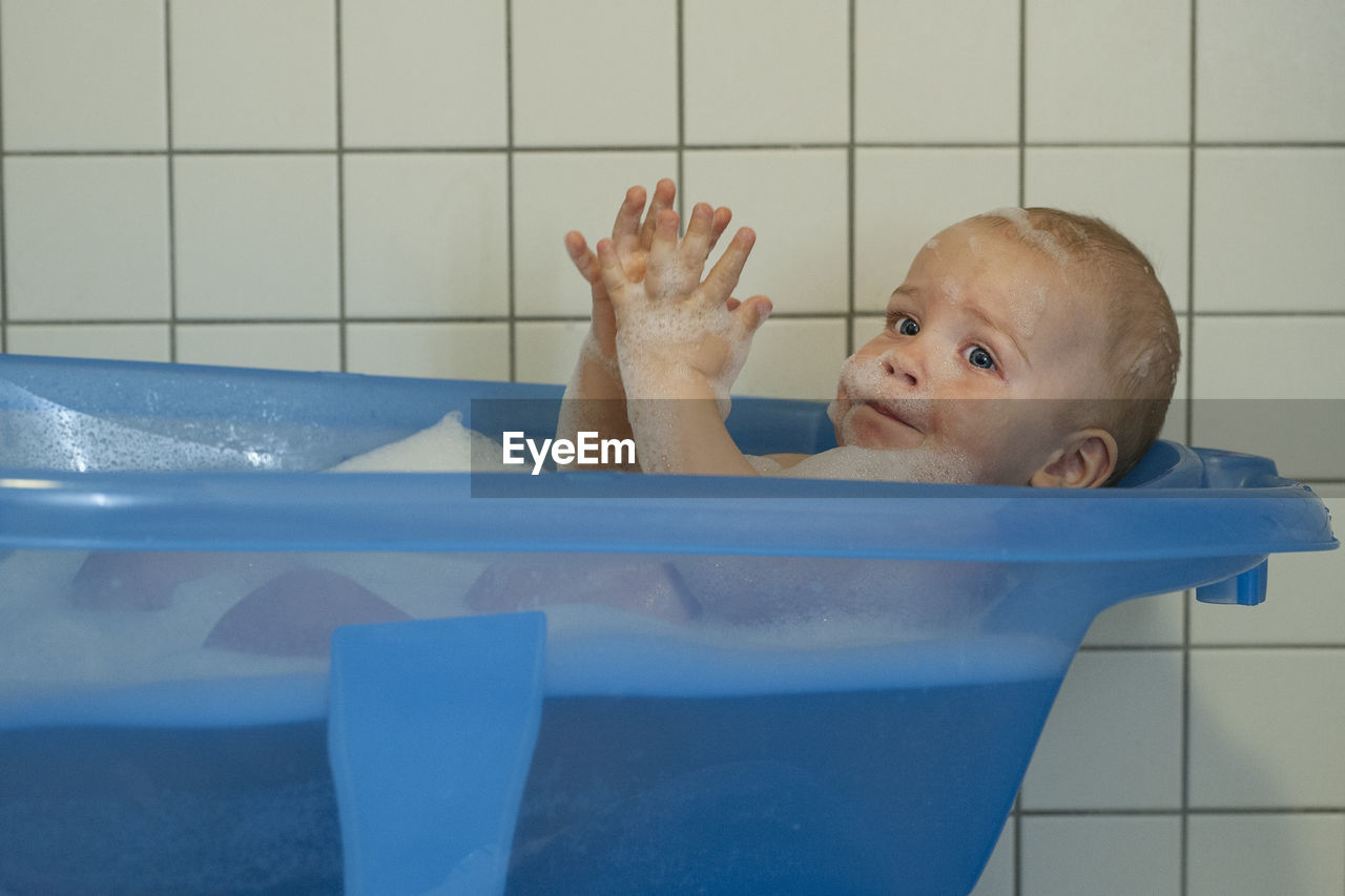 Portrait of boy bathing