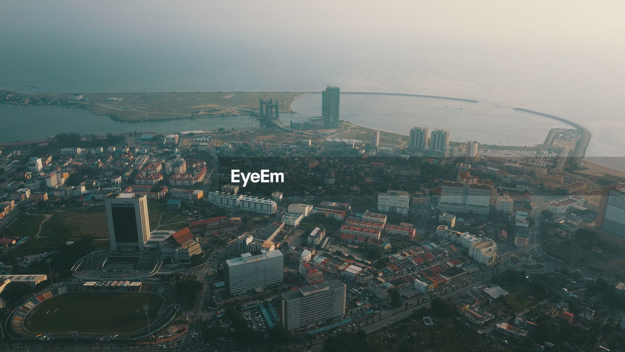 High angle view of buildings in city against sky