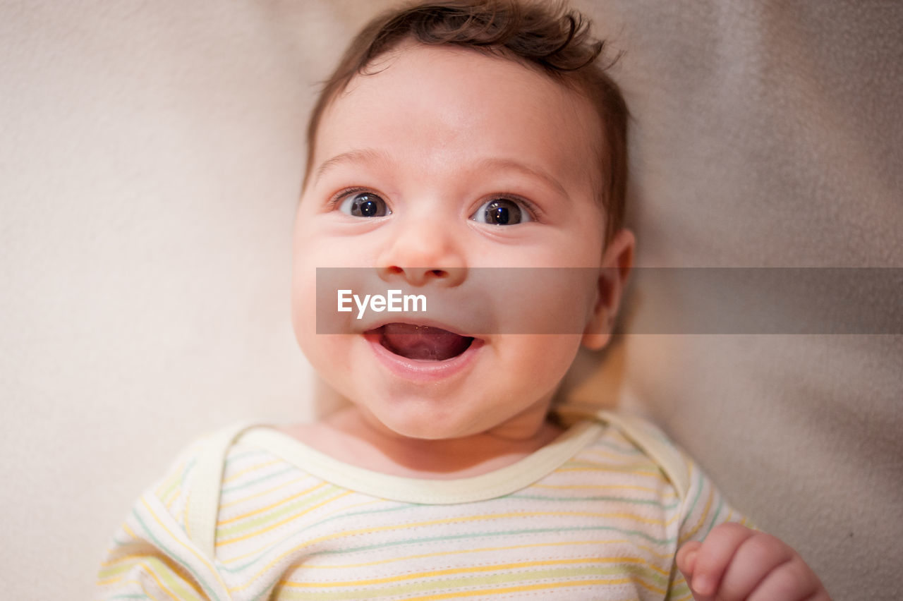 Cute baby boy on bed