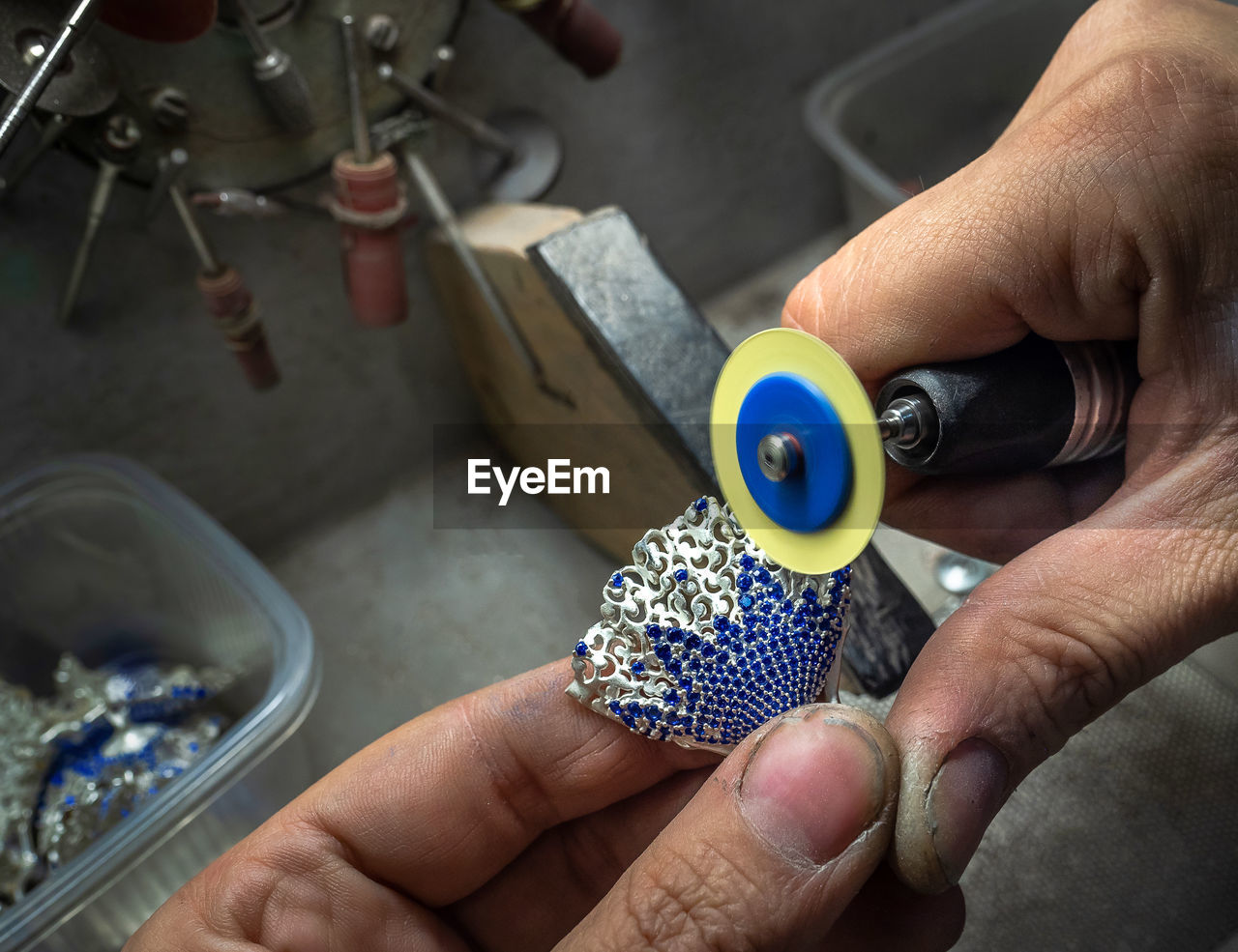 Close-up of hand making jewelry