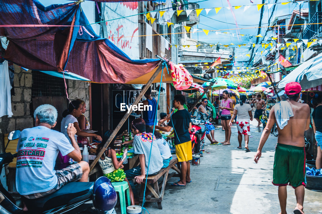 People at street market in city