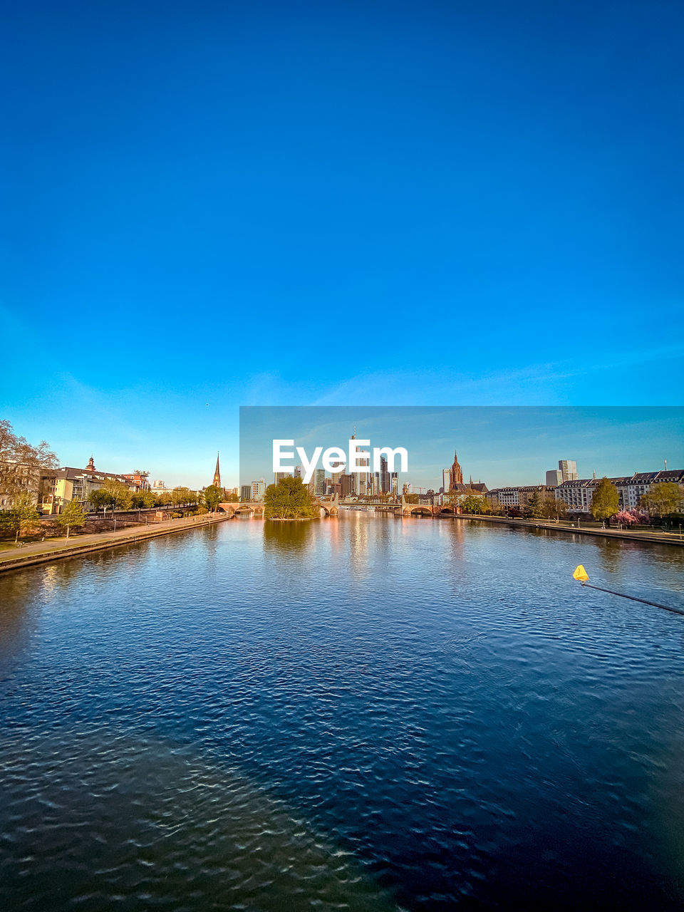 View of bridge over river against blue sky
