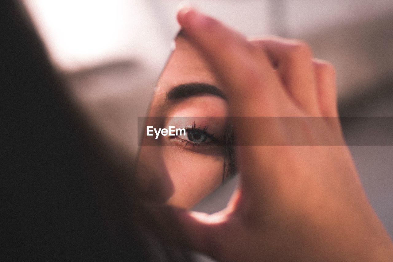 Broken mirror reflecting eye