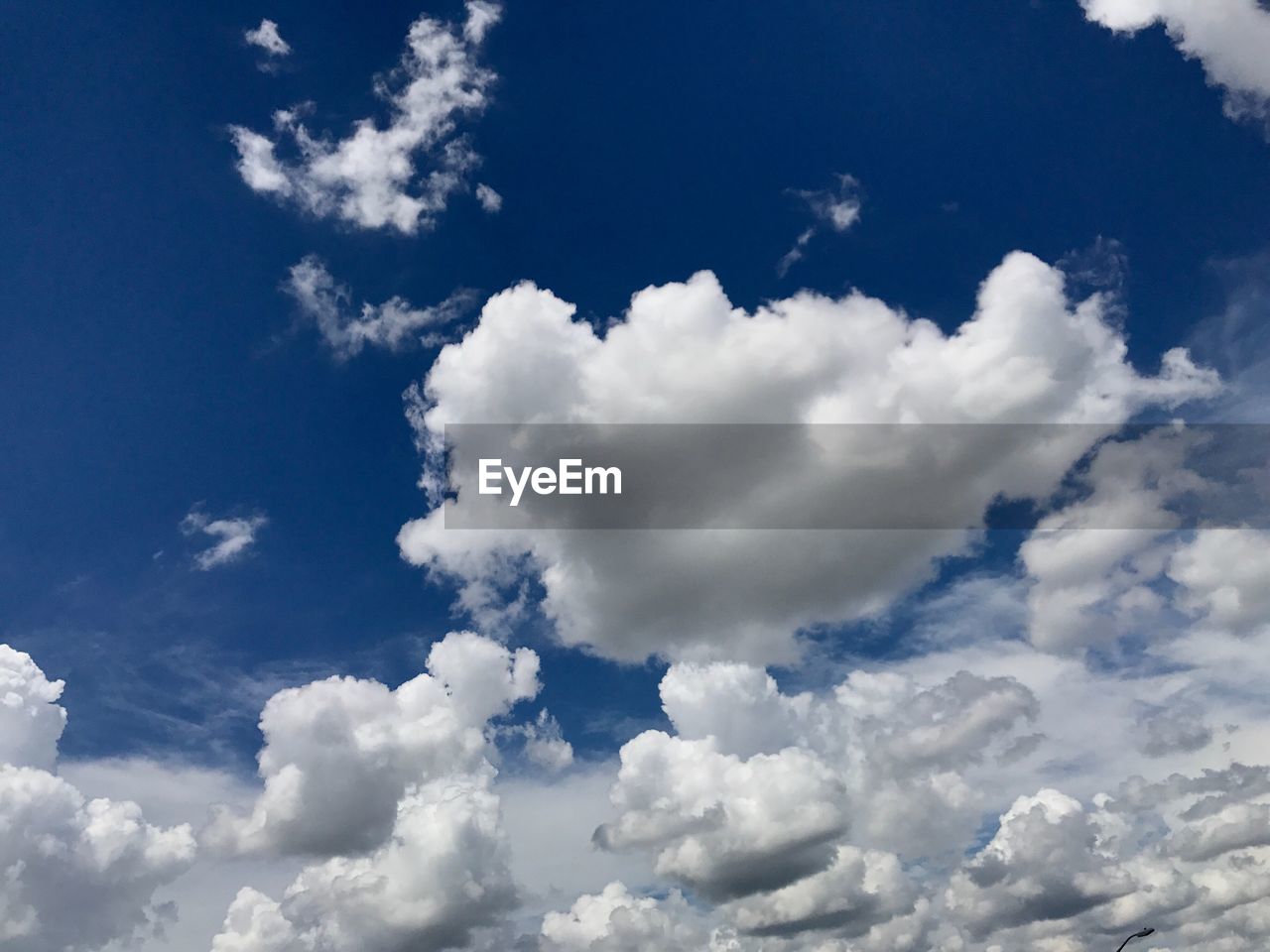 LOW ANGLE VIEW OF WHITE CLOUDS IN SKY