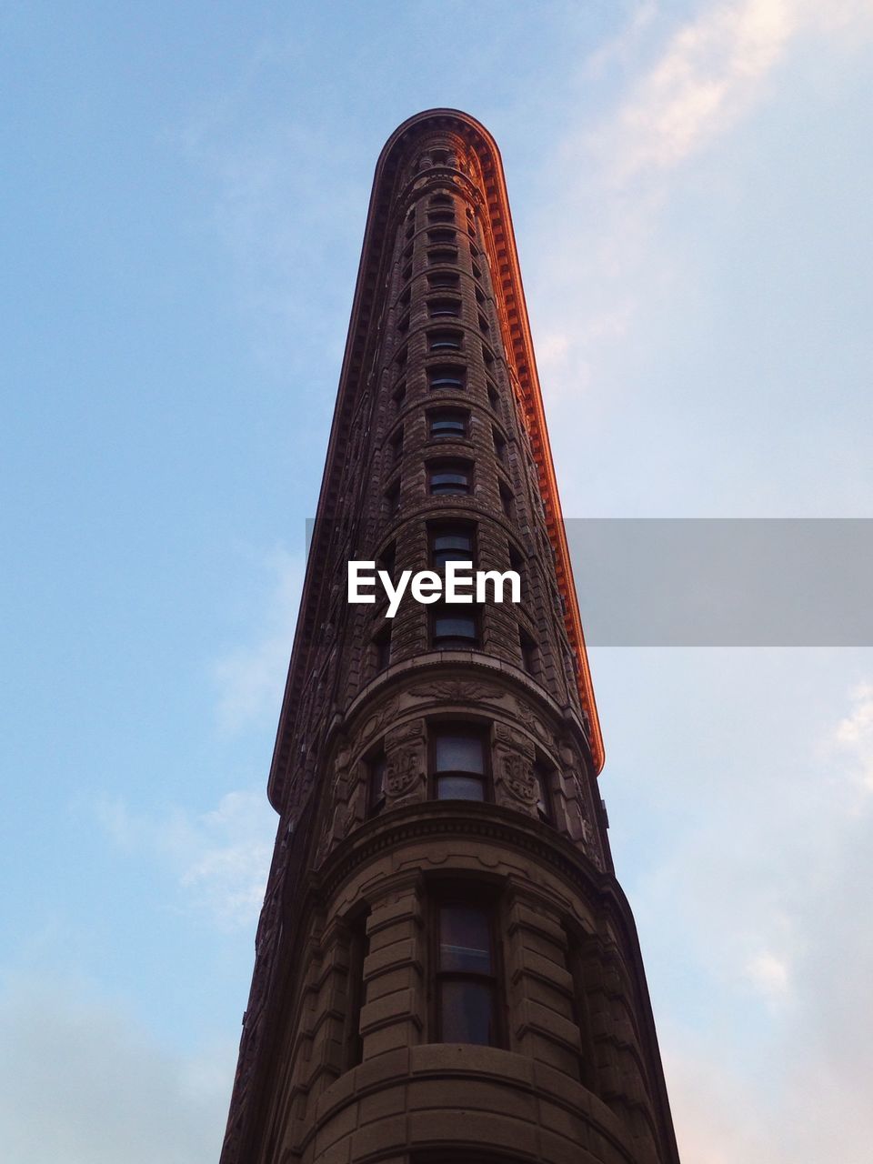 Low angle view of flatiron building against sky