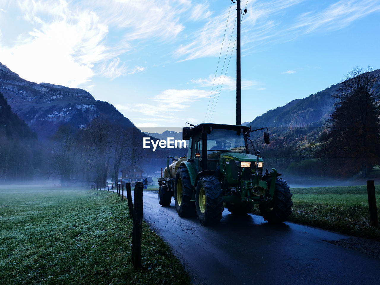 ROAD AMIDST FIELD AGAINST SKY