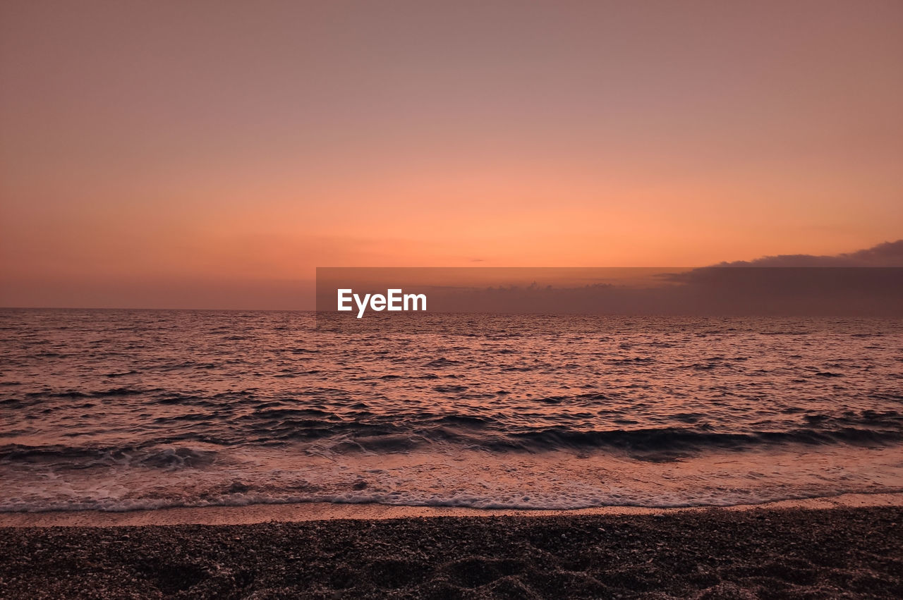 SCENIC VIEW OF SEA DURING SUNSET