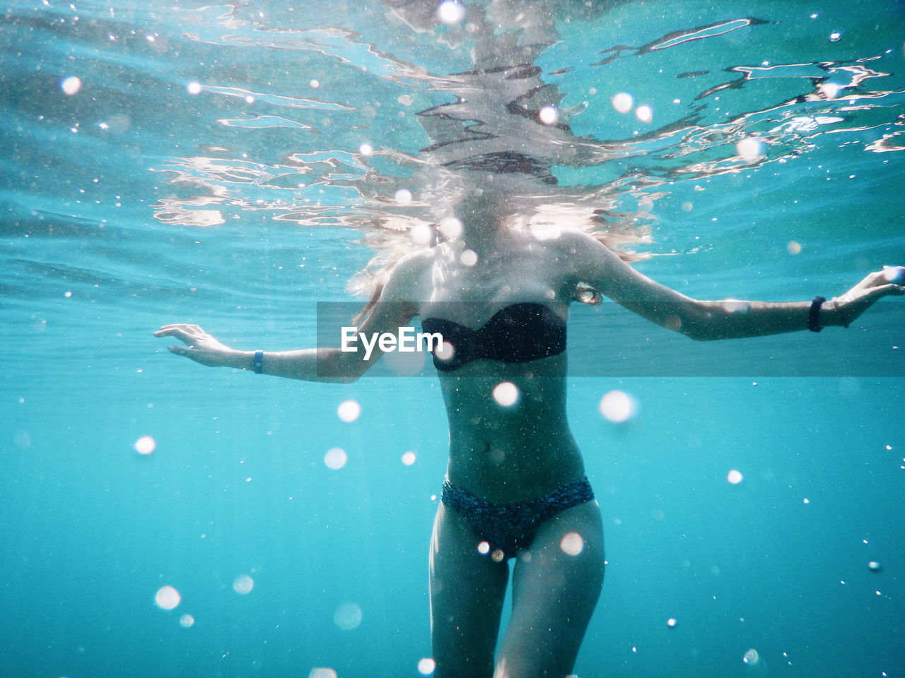 Woman swimming underwater