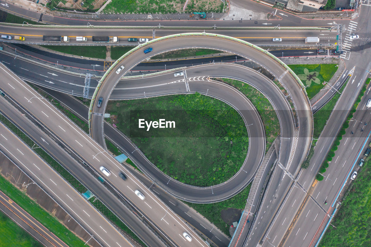 HIGH ANGLE VIEW OF ELEVATED ROAD ON CITY